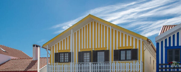 Aveiro, Portugal: August 15 2023: Front view of traditional red and white striped house in Costa Nova Aveiro Portugal symbol of local identity and colorful architecture