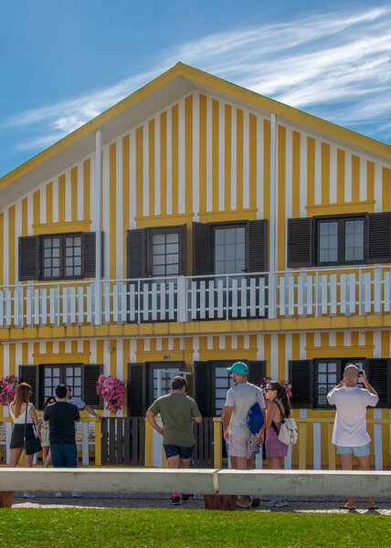 Aveiro, Portugal: August 15 2023: Front view of traditional red and white striped house in Costa Nova Aveiro Portugal symbol of local identity and colorful architecture