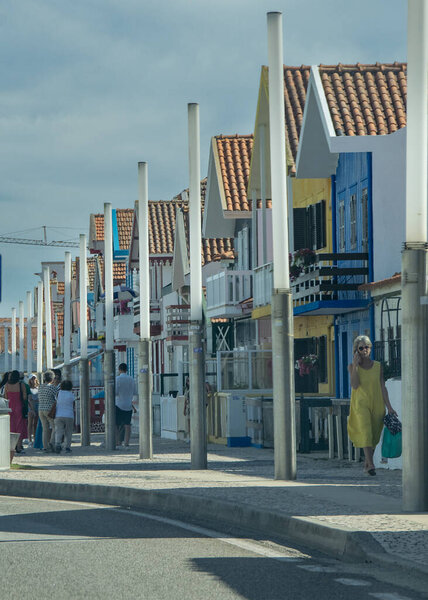 Aveiro, Portugal: August 15 2023: Perspective view of traditional striped houses in Costa Nova, Aveiro,  Portugal, symbol of local identity and colorful architecture