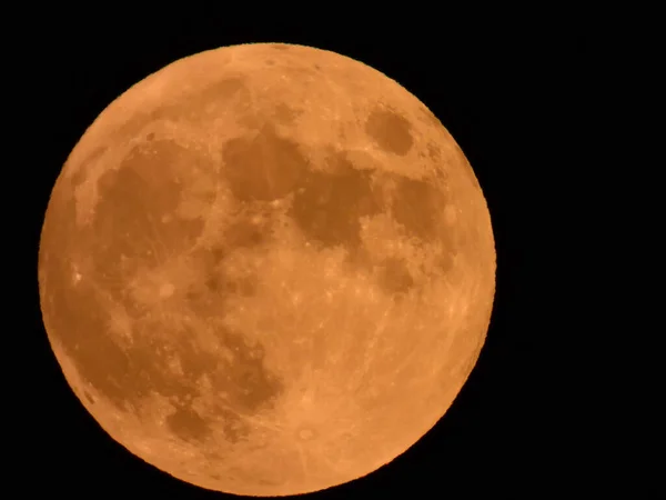 2020 July's Hunter moon in the dark night sky over Lakeville, Massachusetts, USA.