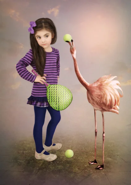 Little girl and flamingos — Stock Photo, Image