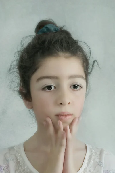 Little girl with sad eyes — Stock Photo, Image
