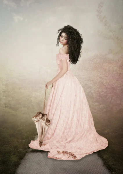 Girl in pink long dress with umbrella — Stock Photo, Image