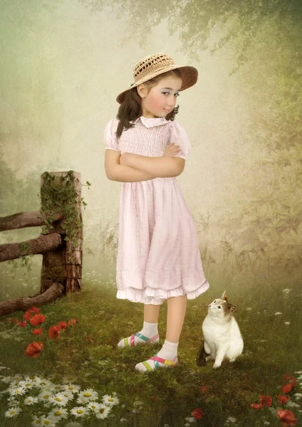 Girl in dress and kitten Stock Picture