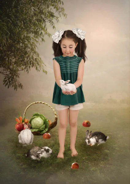 Little girl with rabbits — Stock Photo, Image