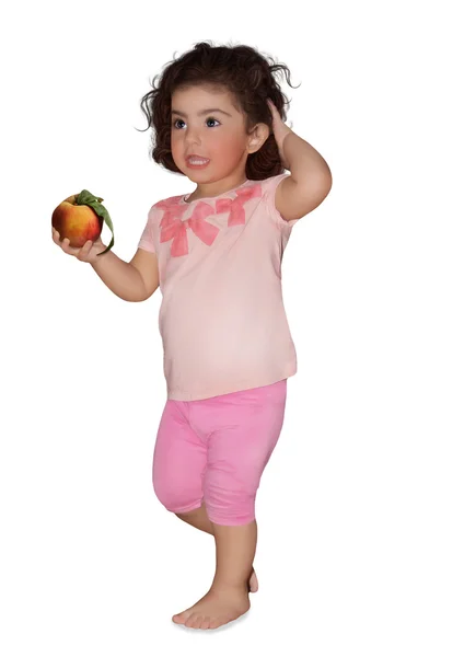 Surprised little girl holding peach — Stock Photo, Image