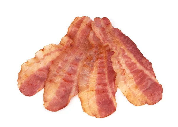 Skivor av bacon på vit bakgrund — Stockfoto