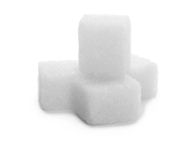 Cubes de sucre sur un blanc — Photo