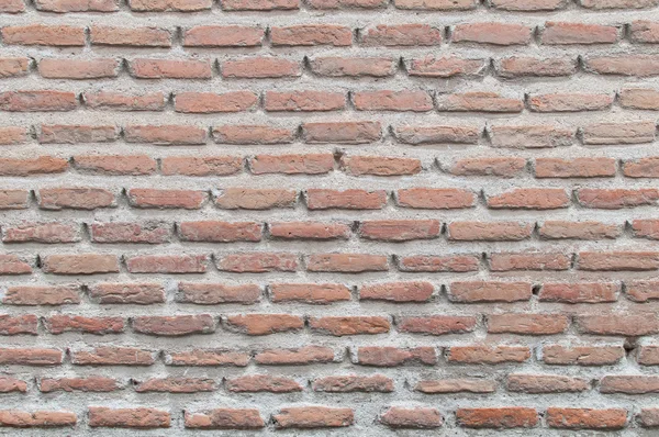 Fondo viejo textura real con ladrillos rojos de una pared — Foto de Stock