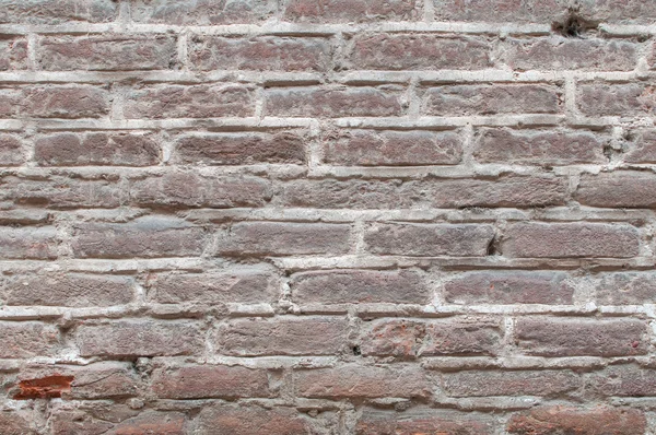 Oude echte achtergrondstructuur met rode bakstenen van een muur — Stockfoto