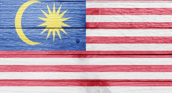 Malaysische Flagge auf einer Holzplanke — Stockfoto