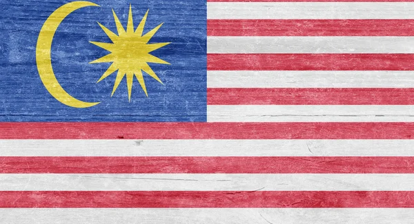 Malaysische Flagge auf einer Holzplanke — Stockfoto