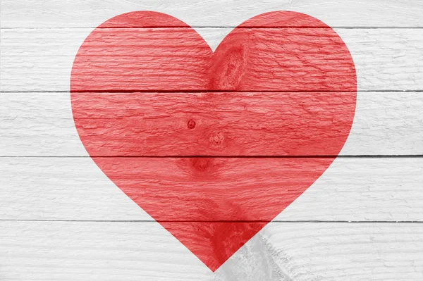 Red heart silhouette on a wooden plank — Stock Photo, Image