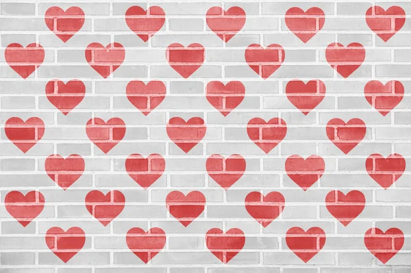 Muitas silhuetas de coração vermelho em uma parede de tijolo Imagens De Bancos De Imagens