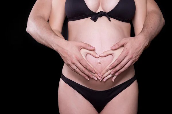 Man hands touching stomach of his pregnant woman — Stock Photo, Image