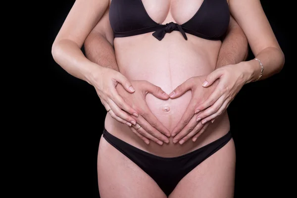 Man hands touching stomach of his pregnant woman — Stock Photo, Image