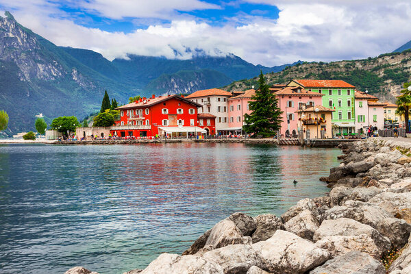 Wonderful nature scenery and lakes of Europe.Beautiful lake Lago di Grada. view of Torbole village with colorful houses . Italy, Trento ,may 2014