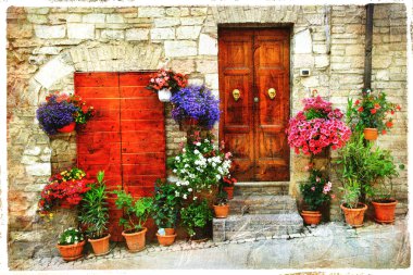 eski İtalyan Köyü güzel çiçek sokaklarında. Spello, artisti