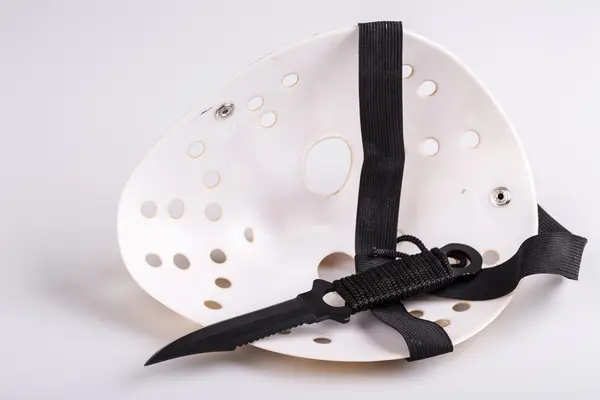 Murderer mask and knife on white — Stock Photo, Image