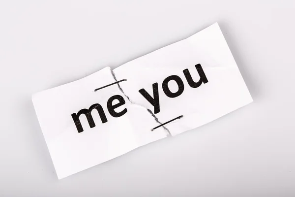 "ME YOU" words written on torn and stapled paper — Stock Photo, Image