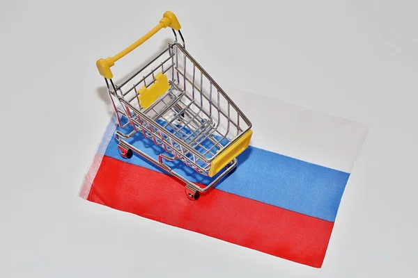 Shopping cart on Russia flag — Stock Photo, Image