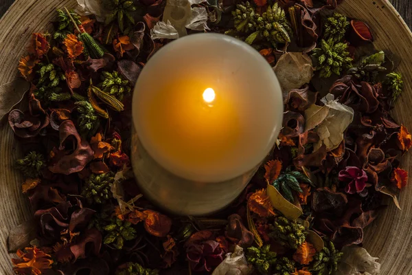 Candle on the wooden plate — Stock Photo, Image