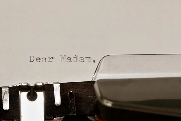 Text Dear madam typed on old typewriter — Stock Photo, Image