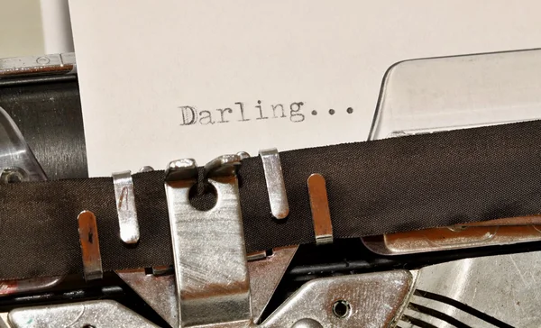 Darling word typed on old black typwriter — Stock Photo, Image