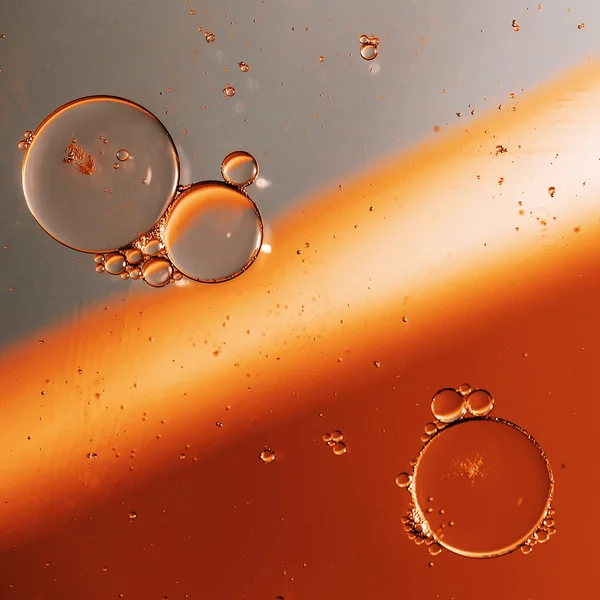 Oil drops on a water surface — Stock Photo, Image