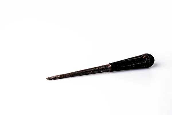 Old black screwdriver on white background — Stock Photo, Image