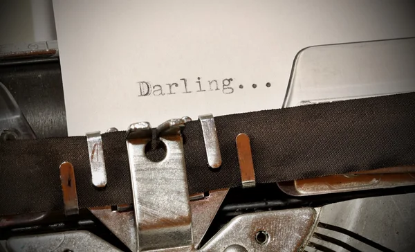 Darling word typed on old black typwriter — Stock Photo, Image