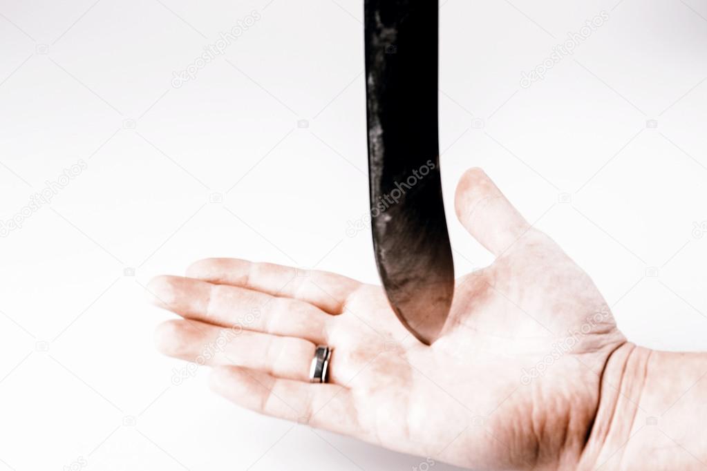 Close up of a suicidal man hand on isolated white background