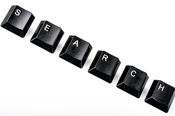 Pesquisa de texto formada com teclas de teclado do computador em backgrou branco — Fotografia de Stock