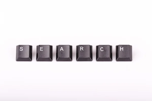 与电脑键盘按键在白色背景上形成的文本搜索 — 图库照片
