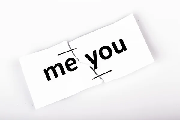 "ME YOU" words written on torn and stapled paper — Stock Photo, Image