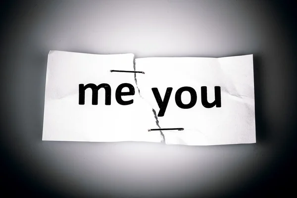 "ME YOU" words written on torn and stapled paper — Stock Photo, Image