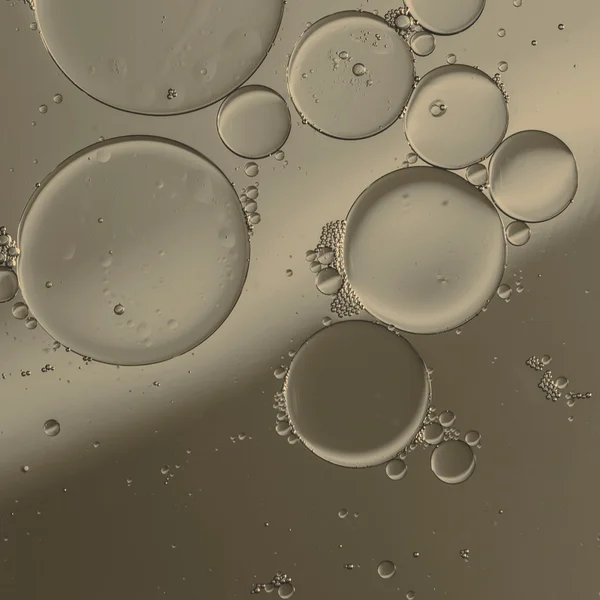 Oil drops on a water surface — Stock Photo, Image