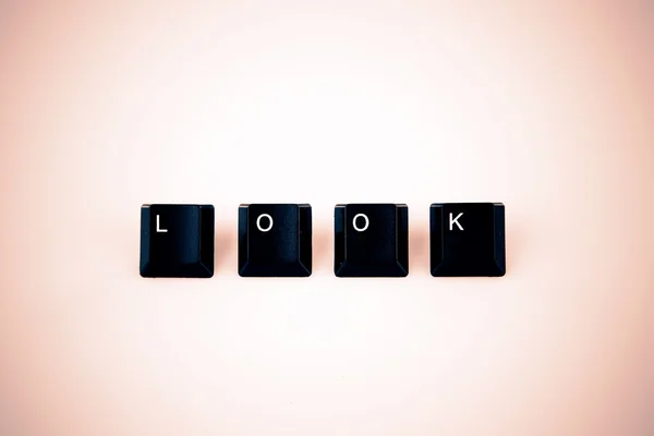 Look word written with black computer buttons over white — Stock Photo, Image