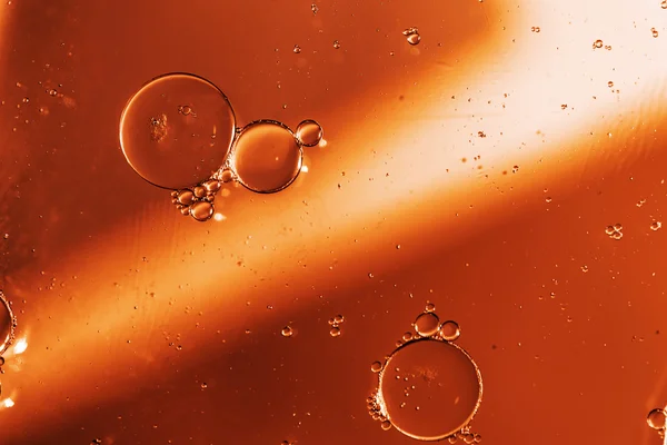 Oil drops on a water surface — Stock Photo, Image