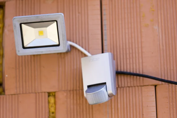 Security led light with motion dectector or sensor on the wall — Stock Photo, Image