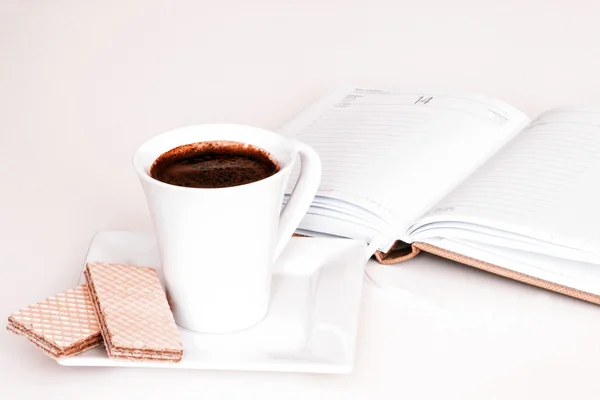 Cup of tea with notebook — Stock Photo, Image