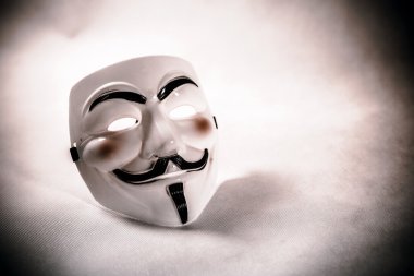 White and yellow anonymous masks