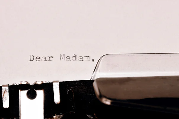 Text Dear madam typed on old typewriter — Stock Photo, Image