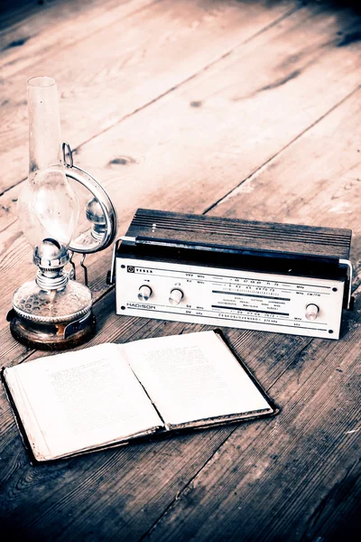 Kerosene lamp and radio and book — Stock Photo, Image