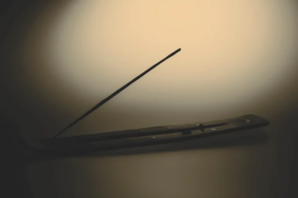 Incense stick on a wooden support on a white background — Stock Photo, Image