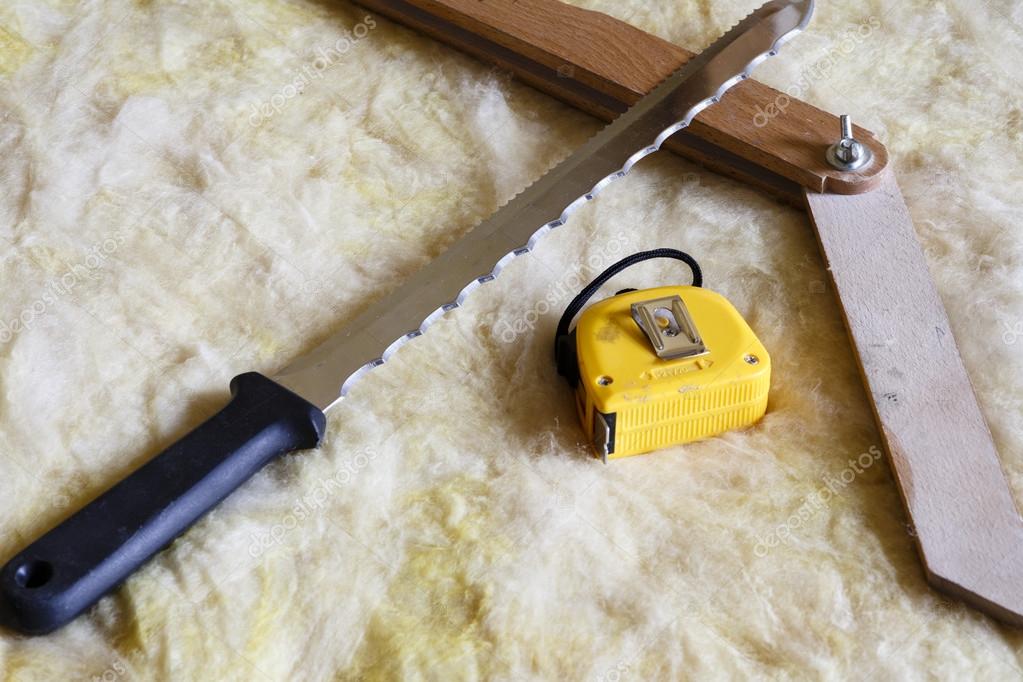 Mineral wool THERMAL INSULATION with meter, knife and protractor Stock Photo by ©jarin13 87293948