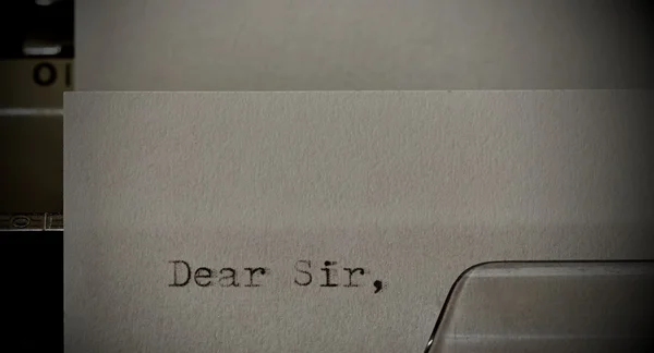 Text Dear Sir typed on old typewriter — Stock Photo, Image