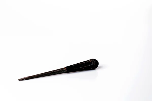 Old black screwdriver on white background — Stock Photo, Image