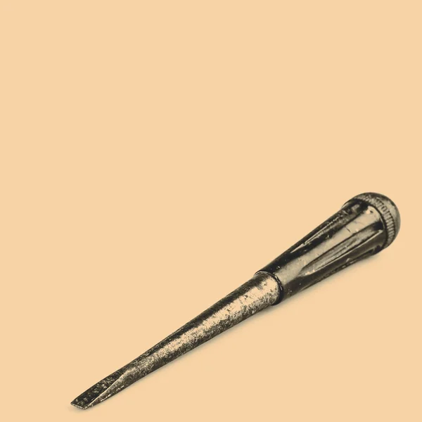 Old black screwdriver on white background — Stock Photo, Image