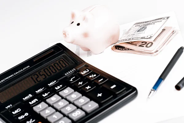 Business Charts with calculator, money, piggy box and pen — Stock Photo, Image